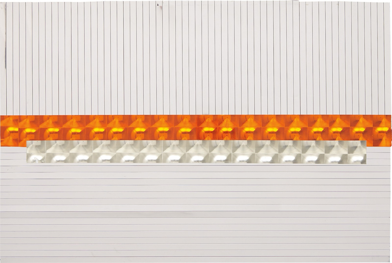 The same striped panel and its orange and silver reflector bands, photographed under brighter light that renders the grey almost white.