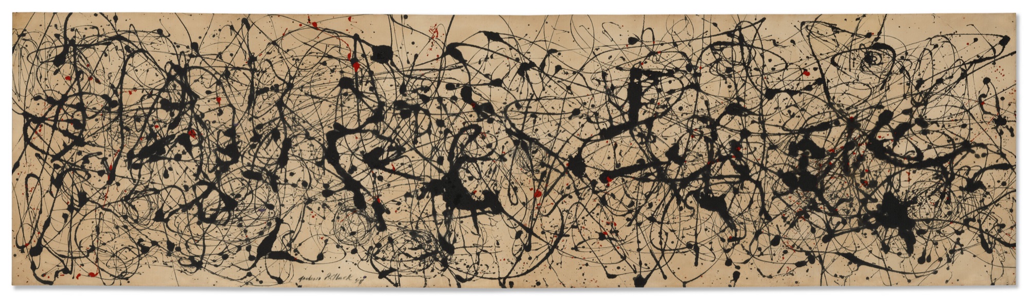 A long horizontal canvas covered edge to edge in looping black poured lines with small flecks of red over a pale buff ground.